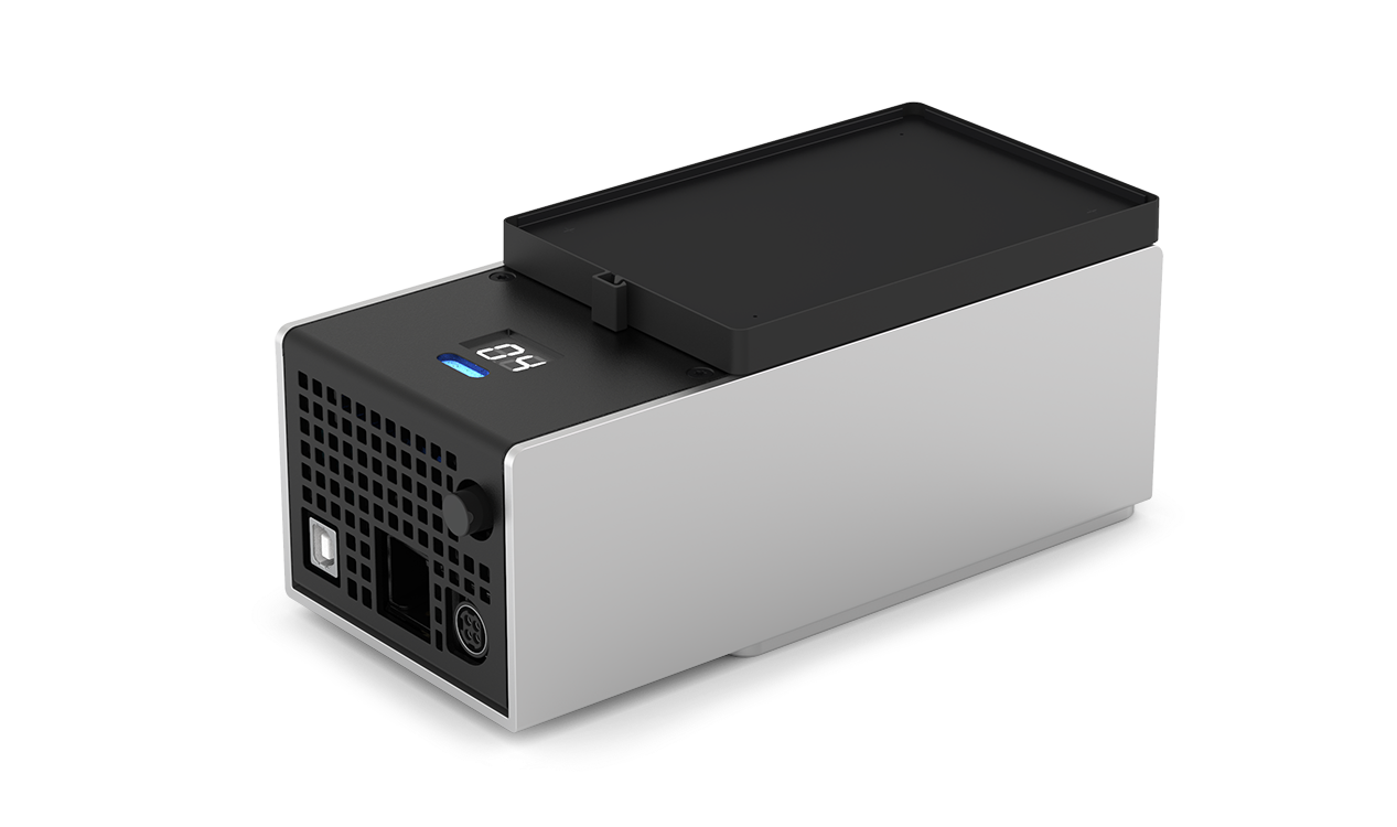 The Temperature Module as seen from the top left. The top of the module has the heating and cooling surface and temperature display. The side has the power button, USB port, and power port.