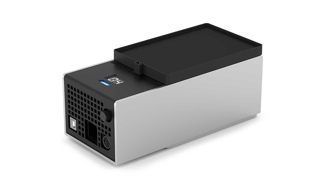 The Temperature Module as seen from the top left. The top of the module has the heating and cooling surface and temperature display. The side has the power button, USB port, and power port.
